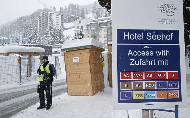 A police officer guards a checkpoint at the Seehof hotel during the World Economic Forum in Davos, Switzerland, Wednesday, January 20, 2016. (AP/Michel Euler)