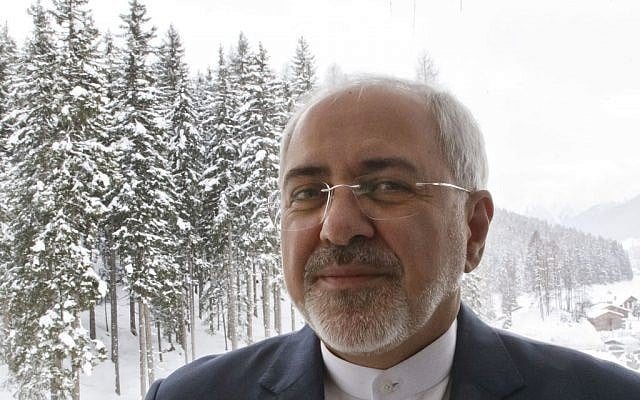 Iranian Foreign Minister Mohammad Javad Zarif poses on the balcony after an interview with The Associated Press on the sideline of the World Economic Forum in Davos, Switzerland, Wednesday, Jan. 20, 2016. (AP Photo/Michel Euler)