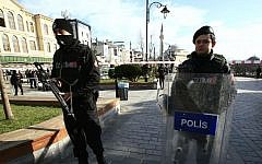 Policemen secure an area at the historic Sultanahmet district, which is popular with tourists, after a suicide bombing that killed 10 in Istanbul, Tuesday, Jan. 12, 2016. (AP Photo/Lefteris Pitarakis)