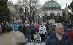 Tourists walk at the site of Tuesday's explosion in the historic Sultanahmet district in Istanbul, Wednesday, Jan. 13, 2016. (AP Photo/Lefteris Pitarakis)