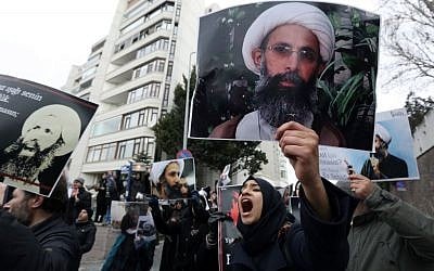 Iranian and Turkish demonstrators hold pictures of Shiite cleric Sheikh Nimr al-Nimr as they protest outside the Saudi Embassy in Ankara, Turkey, Sunday, January 3, 2016, following Saudi Arabia's execution of 47 prisoners in one day. (A/Burhan Ozbilici) Iranian and Turkish demonstrators hold pictures of Shiite cleric Sheikh Nimr al-Nimr as they protest outside the Saudi Embassy in Ankara, Turkey, Sunday, January 3, 2016, following Saudi Arabia's execution of 47 prisoners in one day. (A/Burhan Ozbilici)