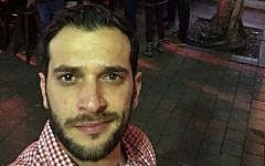 Alon Bakal, one the victims of a January 1, 2016 shooting attack in Tel Aviv, seen outside the Simta bar on December 20, 2015 (Courtesy Facebook)