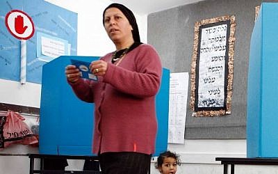 An ultra-Orthodox Jewish woman casts her vote in a polling station on Tuesday, 28 March 2006. (Nati Shohat/Flash90)