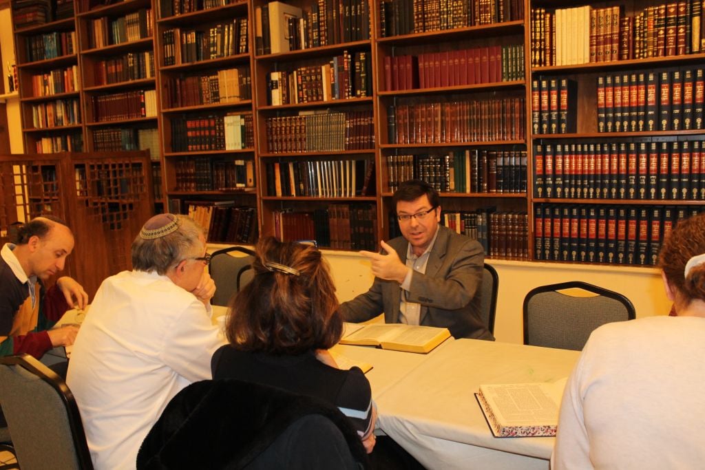Rabbi Avidan Milevsky, gesturing, leading a Sunday morning Talmud class after services at Kesher Israel in Washington, D.C., December 20, 2015. (Uriel Heilman/JTA) Rabbi Avidan Milevsky, gesturing, leading a Sunday morning Talmud class after services at Kesher Israel in Washington, D.C., December 20, 2015. (Uriel Heilman/JTA)