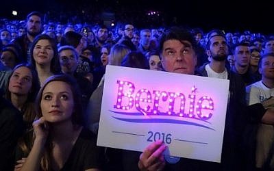 Supporters listen as Democratic presidential candidate Bernie Sanders addresses a campaign event at the University of Iowa in Iowa City, Iowa, January 30, 2016, ahead of the Iowa Caucus. (AFP / WILLIAM EDWARDS)