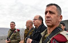Former Deputy Chief of Staff Yair Golan speaks with then-Defense Minister Moshe Ya'alon (second from the right) and Northern Command head Aviv Kochavi (right) during a visit to Israel's northern border following a Hezbollah attack the day before, on January 5, 2016. (Ariel Hermoni/Defense Ministry)