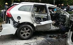 Wreckage of the car blown up in a gang hit near the Tel Aviv Stock Exchange in Tel Aviv, January 19, 2016; Police spokesman's office