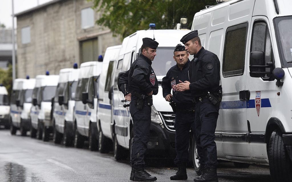 French police conducting an operation in La Courneuve, near Paris, Aug. 27, 2015. (Miguel Medina/AFP/Getty Images, via JTA) French police conducting an operation in La Courneuve, near Paris, Aug. 27, 2015. (Miguel Medina/AFP/Getty Images, via JTA)