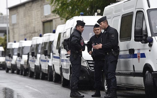 French police conducting an operation in La Courneuve, near Paris, Aug. 27, 2015. (Miguel Medina/AFP/Getty Images, via JTA) French police conducting an operation in La Courneuve, near Paris, Aug. 27, 2015. (Miguel Medina/AFP/Getty Images, via JTA)