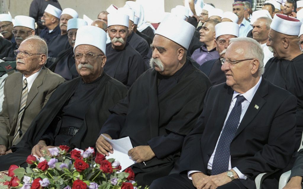 File: President Reuven Rivlin sits with members of Israel's  Druze community, on September 24, 2015.  (Mark Neyman/GPO)