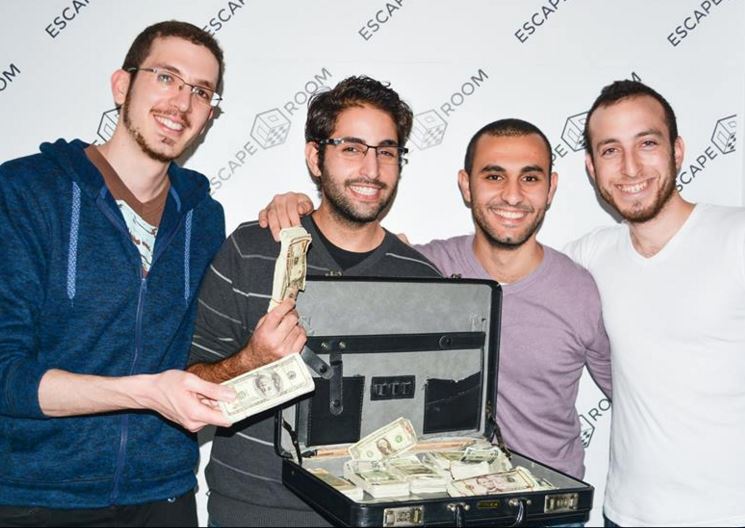 Players at Escape Room Tel Aviv find the suitcase filled with 'cash' (Courtesy Escape Room Tel Aviv) Players at Escape Room Tel Aviv find the suitcase filled with 'cash' (Courtesy Escape Room Tel Aviv)