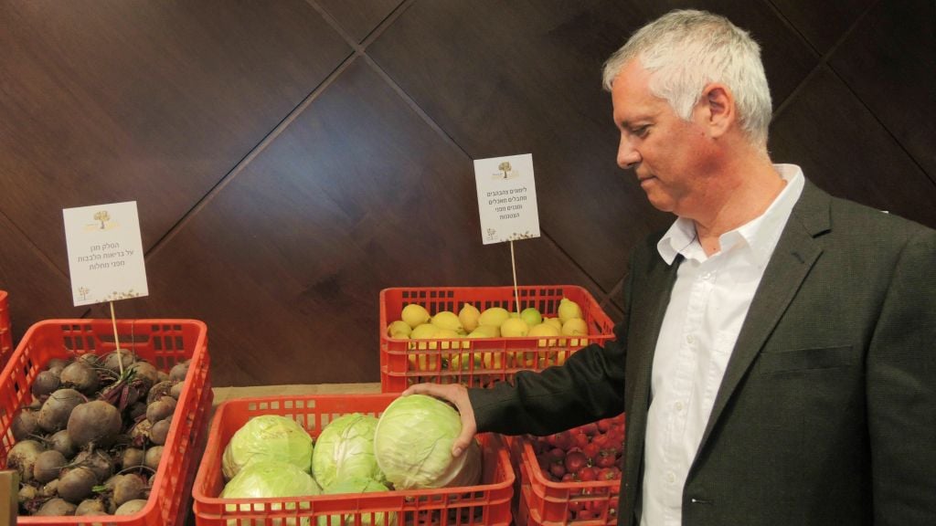 Gidi Kroch, CEO of Leket Israel, with "rescued" food that was deemed to have a blemish or cosmetic issue, on January 6, 2015. About half of Israel‘s wasted food is completely safe and has full nutritional value. (Melanie Lidman/Times of Israel)