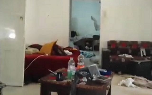 A still image from a video showing the inside purported Arara hideout of Tel Aviv gunman Nashat Milhem, a day after he was shot dead by security forces on January 8, 2016 (screen capture: Ynet)
