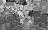 File. An image from a video released by the US Defense Department the American bombing of an Islamic State cash stockpile in Mosul, Iraq on January 11, 2016. (Screen capture: Defense Video & Imagery Distribution System)