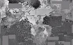 File. An image from a video released by the US Defense Department the American bombing of an Islamic State cash stockpile in Mosul, Iraq on January 11, 2016. (Screen capture: Defense Video & Imagery Distribution System)