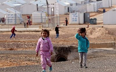 Young Syrian refugees stand at the Azraq refugee camp in northern Jordan on January 30, 2016. (AFP/KHALIL MAZRAAWI)