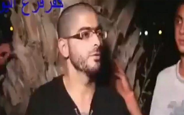 Nashat Milhem is seen competing in a street quiz during Ramadan in footage that emerged of the Tel Aviv gunman, January 2016. (Screen capture: Channel 2) Nashat Milhem is seen competing in a street quiz during Ramadan in footage that emerged of the Tel Aviv gunman, January 2016. (Screen capture: Channel 2)