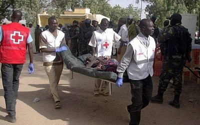Illustrative: A wounded woman is carried on a stretcher in Mora, following suicide attacks in the border city of Kerawa, northern Cameroon, on January 29, 2016. (AFP, Stringer)