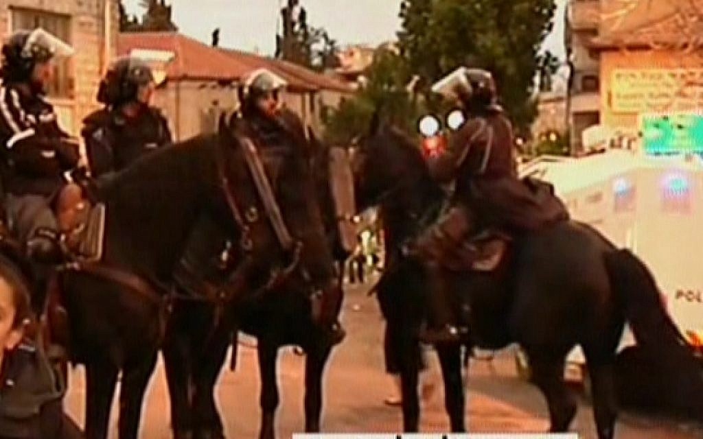 Mounted Israeli police patrol during an ultra-Orthodox protest in Jerusalem on January 7, 2016, after authorities ordered an autopsy on a four-month-old infant from the community (screen capture: Channel 2) Mounted Israeli police patrol during an ultra-Orthodox protest in Jerusalem on January 7, 2016, after authorities ordered an autopsy on a four-month-old infant from the community (screen capture: Channel 2)