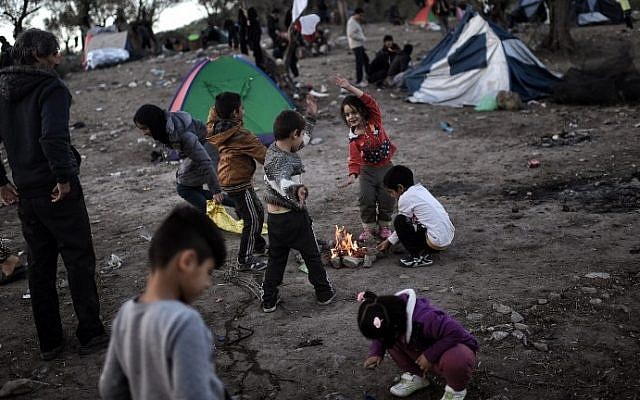 This file photo taken on November 4, 2015 shows refugee and migrant children, living in a field next door to the Moria camp on the Greek island of Lesbos. (AFP / ARIS MESSINIS) This file photo taken on November 4, 2015 shows refugee and migrant children, living in a field next door to the Moria camp on the Greek island of Lesbos. (AFP / ARIS MESSINIS)
