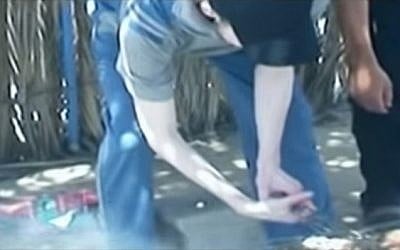 Still image from a Hamas video released on January 3, 2016, apparently showing IDF soldier Gilad Shalit tending a barbecue during his captivity in Gaza. (screen capture)