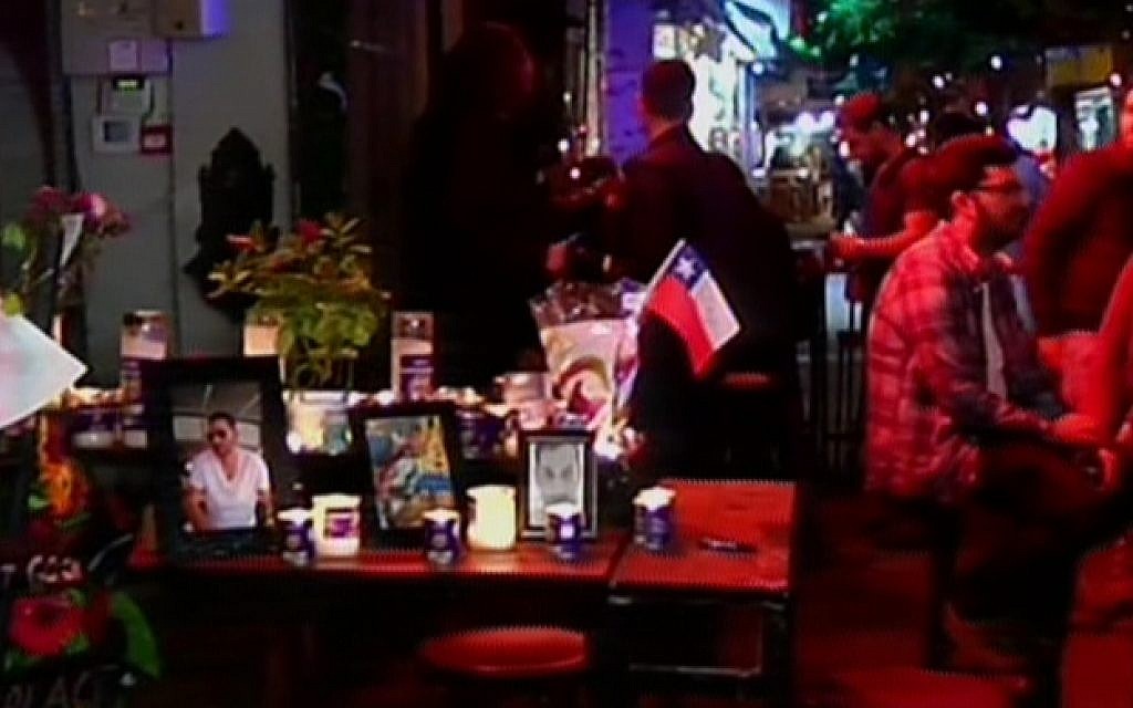 Simta bar on Dizengoff Street in Tel Aviv puts on a memorial to the two victims of a New year's Day shooting attack there, as it reopens on January 6, 2016 (screen capture: Channel 2)