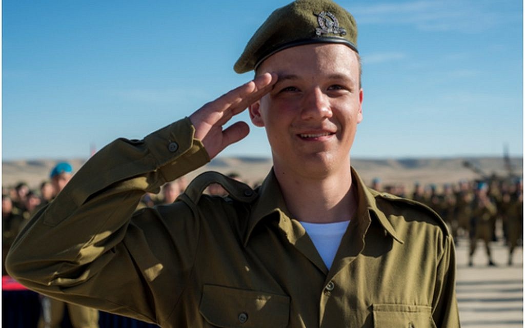 Seth, whose name has been withheld for privacy concerns, salutes after having received an award from his battalion commander for bravery on January 6, 2016. (IDF Spokesperson's Unit) Seth, whose name has been withheld for privacy concerns, salutes after having received an award from his battalion commander for bravery on January 6, 2016. (IDF Spokesperson's Unit)