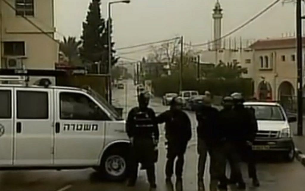 Security forces in the village of Arara, where fugitive gunman Nashat Milhem was shot dead on January 8, 2016 (screen capture: Channel 2)