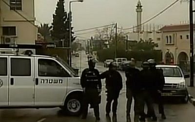 Security forces in the village of Arara, where fugitive gunman Nashat Milhem was shot dead on January 8, 2016 (screen capture: Channel 2)