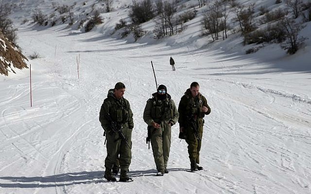 IDF soldiers patrol a slope at the Mount Hermon ski resort, on January 21, 2016. (Thomas Coex/AFP)