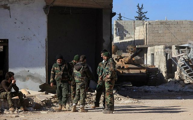 Syrian government forces stand in the village of Tal Jabin, north of the embattled city of Aleppo, as they advanced to break a three-year rebel siege of two government-held Shiite villages, Nubol and Zahraa, and take control of parts of the supply route to the area on February 3, 2016. (George Ourfalian/AFP) Syrian government forces stand in the village of Tal Jabin, north of the embattled city of Aleppo, as they advanced to break a three-year rebel siege of two government-held Shiite villages, Nubol and Zahraa, and take control of parts of the supply route to the area on February 3, 2016. (George Ourfalian/AFP)