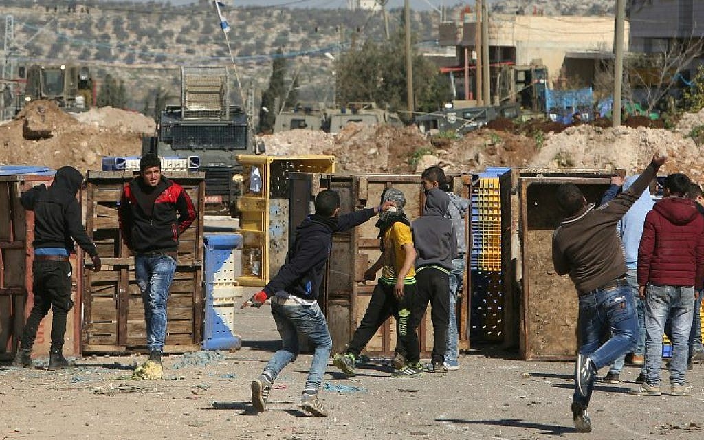 Palestinian youths clash with Israeli security forces in Qabatiya, a town near Jenin in the northern West Bank, on February 4, 2016. (Jaafar Ashtiyeh/AFP)
