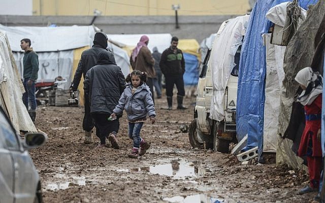 Syrian refugees are pictured in a camp as Syrians fleeing the northern embattled city of Aleppo wait on February 6, 2016 in Bab al-Salam, near the city of Azaz, northern Syria, near the Turkish border crossing. (AFP/BULENT KILIC) Syrian refugees are pictured in a camp as Syrians fleeing the northern embattled city of Aleppo wait on February 6, 2016 in Bab al-Salam, near the city of Azaz, northern Syria, near the Turkish border crossing. (AFP/BULENT KILIC)