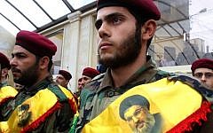 Members of Hezbollah attend the funeral of Ali Ahmed Sabra, a fellow fighter who was killed in combat alongside Syrian government forces in Aleppo, on February 6, 2016, in the Lebanese village of Jibshit. (AFP / MAHMOUD ZAYYAT)