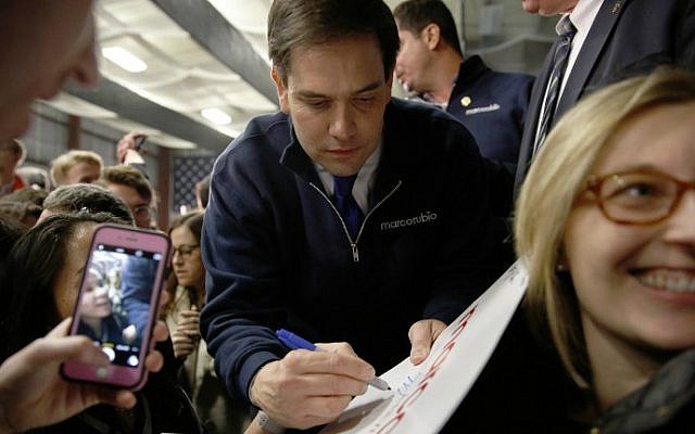 Republican presidential candidate Sen. Marco Rubio autographs a sign during a Super Bowl watching party at Ultimate Sports Academy, February 7, 2016, in Manchester, New Hampshire. (Dominick Reuter/AFP) Republican presidential candidate Sen. Marco Rubio autographs a sign during a Super Bowl watching party at Ultimate Sports Academy, February 7, 2016, in Manchester, New Hampshire. (Dominick Reuter/AFP)