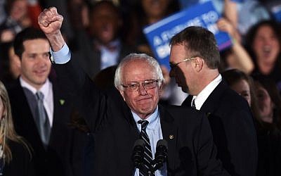US Democratic presidential candidate Bernie Sanders celebrates his victory during the primary night rally in Concord, New Hampshire, on February 9, 2016. (AFP/Jewel Samad)