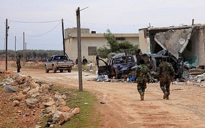 Syrian government forces who took control of the village of Kiffin on the northern outskirts of the embattled city of Aleppo from opposition forces on February 11, 2016. (AFP/George Ourfalian)