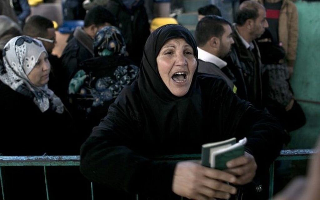 Palestinians await permission to enter Egypt as they gather at the Rafah Border Crossing in the southern Gaza Strip, on February 14, 2016. (AFP/Said Khatib) Palestinians await permission to enter Egypt as they gather at the Rafah Border Crossing in the southern Gaza Strip, on February 14, 2016. (AFP/Said Khatib)
