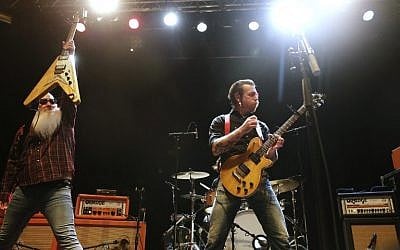 Singer and guitarist of US rock band Eagles of Death Metal, Jesse Hugues, right, performs on stage at the Sentrum Scene concert hall in Oslo on February 14, 2016. (AFP / NTB Scanpix / Roald, Berit)