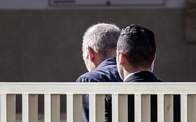 Former prime minister Ehud Olmert (L) arrives at Ma'asiyahu Prison in the central Israeli city of Ramle on February 15, 2016 as he begins serving a 19-month sentence for bribery and obstruction of justice. (AFP/Jack Guez)