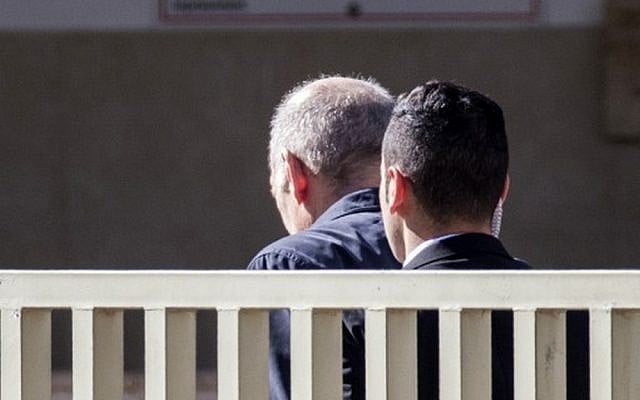 Former prime minister Ehud Olmert (L) arrives at Ma'asiyahu Prison in the central Israeli city of Ramle on February 15, 2016 as he begins serving a 19-month sentence for bribery and obstruction of justice. (AFP/Jack Guez) Former prime minister Ehud Olmert (L) arrives at Ma'asiyahu Prison in the central Israeli city of Ramle on February 15, 2016 as he begins serving a 19-month sentence for bribery and obstruction of justice. (AFP/Jack Guez)
