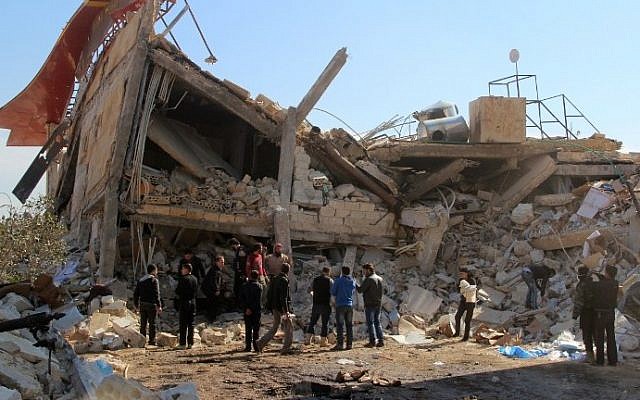 File: People gather around the rubble of a hospital supported by Doctors Without Borders (MSF) near Maaret al-Numan, in Syria's northern province of Idlib, on February 15, 2016, after the building was hit by suspected Russian air strikes. (Ghaith Omran/Al Maarra Today/AFP) File: People gather around the rubble of a hospital supported by Doctors Without Borders (MSF) near Maaret al-Numan, in Syria's northern province of Idlib, on February 15, 2016, after the building was hit by suspected Russian air strikes. (Ghaith Omran/Al Maarra Today/AFP)
