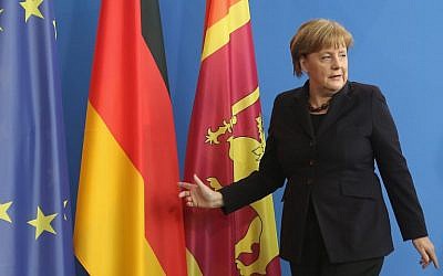 German chancellor Angela Merkel leaves a  press conference at the Chancellery in Berlin on February 17, 2016.  (AFP / Adam BERRY)