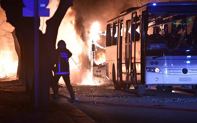 Firefighters try to extinguish flames following an explosion after an attack targeted a convoy of military service vehicles in Ankara on February 17, 2016. (AFP / STRINGER)