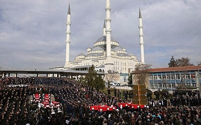 Honour guards carry the Turkish flag-draped coffins of car bombing victims during a funeral ceremony at Kocatepe Mosque in Ankara on February 19, 2016, two days after 28 people were killed in an attack in the capital. (AFP/ADEM ALTAN)
