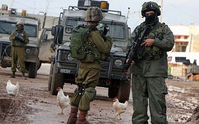 Israeli soldiers during clashes with Palestinian protesters in the village of Qabatiya, near the West Bank town of Jenin on February 22, 2016. (AFP/JAAFAR ASHTIYEH)