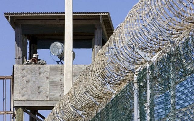 This file photo taken on April 28, 2007 shows a guard yelling down from a guard tower at Camp #4 at Camp Delta in Guantanamo Bay Naval Station, Cuba.(AFP / AFP FILES / PAUL J. RICHARDS)
