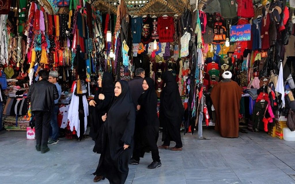 Illustrative: Iranian women shop near the Hazrat Fatimah Ma'sumeh mausoleum in the holy city of Qom, 130 kilometers south of Tehran, on February 24, 2016. (AFP / ATTA KENARE) Illustrative: Iranian women shop near the Hazrat Fatimah Ma'sumeh mausoleum in the holy city of Qom, 130 kilometers south of Tehran, on February 24, 2016. (AFP / ATTA KENARE)