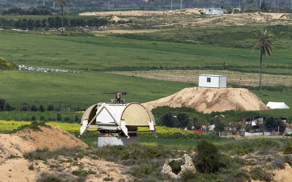 A picture taken from the Israeli side of the border with the Gaza Strip shows an Israeli machine gun (L) facing a Hamas outpost (R) along the border, on February 25, 2016. (Jack Guez/AFP)