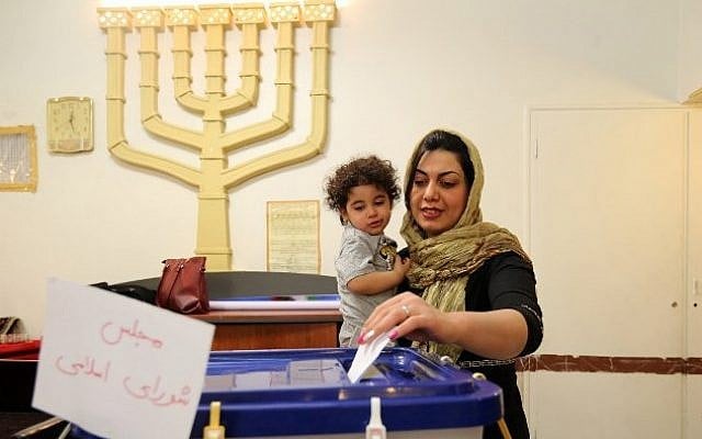 A Jewish Iranian woman casts her vote at a synagogue used as a polling station for the Jewish community in Tehran on February 26, 2016. (AFP / ATTA KENARE) A Jewish Iranian woman casts her vote at a synagogue used as a polling station for the Jewish community in Tehran on February 26, 2016. (AFP / ATTA KENARE)